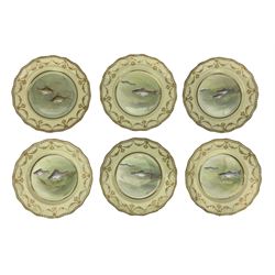 Set of six Victorian Doulton Burslem porcelain plates, each centrally painted with fish, signed by J Hallmark, within raised gilt floral swag borders and gadroon edge, Numbered C.8750, C 9449, D22cm 