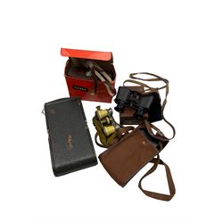 Kodak folding camera, Ilford Sport camera, Pocket Ensign folding camera, Prismoid field glasses and a pair of opera glasses