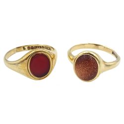 Gold single stone carnelian ring and a single stone goldstone ring, both hallmarked 9ct