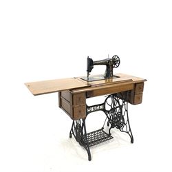 Early 20th century oak and cast iron Singer treadle sewing machine with four drawers