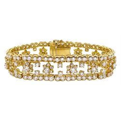 18ct gold round brilliant cut diamond bracelet, thirteen flower motifs, and diamond surround, hallmarked, total diamond weight approx 18.00 carat