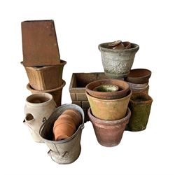 A large collection of garden planters of different styles and sizes