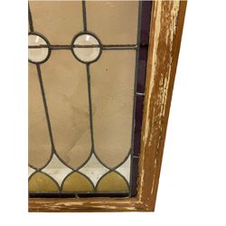 Early to-mid 20th century leaded and stained glass window, with circular bevelled glass, pale amber and yellow stained panes