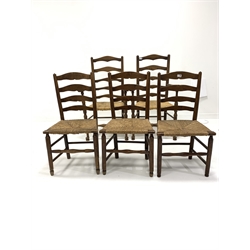 Set of five (2+3) oak ladderback dining chairs, with rush seats, raised on turned supports and stretchers, W62cm