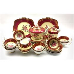 1950's Paragon Fine Bone China tea service for twelve persons, centrally decorated with roses within gilt crimson bands, pattern no. A415/1