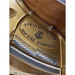 Steinway & Sons - Model O overstrung Grand Piano serial No 576699, manufactured in Hamburg 2006, with 88 keys (7 octaves) in a mahogany finished case with Steinway square-bottom legs and brass rollers castors, with combination agraffe front and rear duplex scale, treble strings with twelve whole and one-half sizes, bass strings copper wound with a steel core, nickel head tuning pins, Steinway hammers, keys, felts, and dampers, with una-corda, sostenuto and sustain pedals.
L 5'10-3/4
