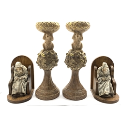  Pair of antique design carved and gilded stands H37cm and a pair of oak bookends with pottery figures of monks  