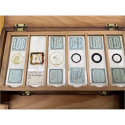 Box of microscope slides with twelve shallow trays, some inscribed 'Marchand, Paris', another box of five shallow trays, another slide box by R & J Beck, London and a box of loose slides etc (4)