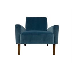 Mid-20th century design armchair, upholstered in ocean blue fabric, raised on oak square tapering supports