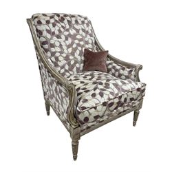 French design hardwood framed armchair, moulded frame with down sweeping arms on S-scroll carved arm supports, upholstered in trailing foliage design in shades of lilac and purple, twist-turned front feet, with small complimentary scatter cushion 