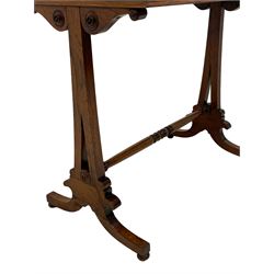 Early Victorian rosewood stretcher table, rectangular top on two tapered and pierced pillars, the skirt with scrolled brackets and turned roundels, splayed supports with turned feet joined by turned stretcher