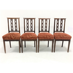 Set four Edwardian mahogany dining chairs, with inlaid cresting rail and pierced splats over red floral upholstered and overstuffed seats, raised on square tapered supports, W45cm