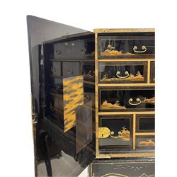 18th century Japanned cabinet on stand, Chinoiserie black lacquered and gilt decoration depicting pagodas within a cliffside waterscape, decorated with trees and birds, the door interiors decorated with overlapping rectangular panels, fitted with a combination of drawers each decorated with similar waterscape scenes, with embossed central lock plate and chased strap hinges, on later black lacquered stand with shaped apron and cabriole supports

Provenance - property of a nobleman 