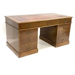 Quality Victorian style 20th century mahogany twin pedestal desk, the top inset with tooled red leather writing surface over one long, six short and one deep drawer fitted for hanging files, raised on plinth base 153cm x 77cm, H77cm