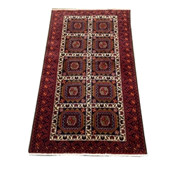 Persian rug, blue ground with ten square plates with geometric design, 185cm x 100cm