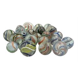Early 20th century glass marbles, some having latticinio and coloured spiral decoration, largest W4cm 