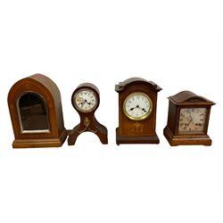 Three Edwardian mantle clocks and one Edwardian clock case