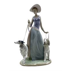 Large Lladro figure 'Elegant Promenade' modelled as a lady walking a Borzoi and Afghan Hound,  no. 5802, boxed