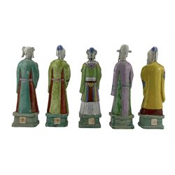 Set of ten 18th century Chinese figures of Immortals, painted in famille rose enamels, modelled standing on rectangular plinths and holding his or her respective attributes, including Cao Guojiu, Han Xiangzi, He Xiangu, Lan Caihe, Li Tieguai, two figures of L Dongbin, Zhang Guolao, Zhongli Quan and Shoulao, H23cm max (10) Provenance: From the Estate of the late Dowager Lady St Oswald