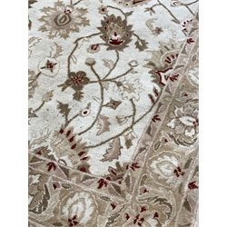 Chinese machined wool cream ground rug, decorated with interlaced foliate, (240cm x 165cm) and another similar rug (245cm x 172cm)