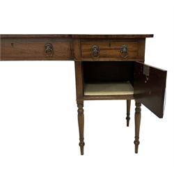 George III mahogany sideboard,  reverse break-front crossbanded top, central false drawer flanked by two drawers and two cupboards, on ring turned supports, fitted with lion mask and ring handles. Provenance: From the Estate of the late Dowager Lady St Oswald
