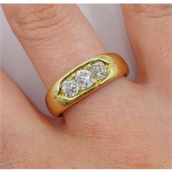 Gold three stone old cut diamond ring, rubover set stamped 18, total diamond weight approx 0.85 carat