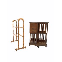 Mahogany two tier revolving bookcase, serpentine moulded top over three drawers and eight shelves with slatted sides, raised on cruciform swivel base with brass and ceramic castors (W54cm, H75cm) together with a pine towel rail (W71cm)