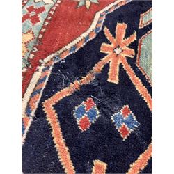 Persian red ground rug with double medallion 