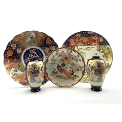 Japanese Imari pattern plate decorated with panels of buildings and flowers in orange, blue etc D30cm, two other Japanese plates and a pair of vases H17cm