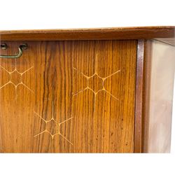 Peter Hayward for Vanson, retailed by Heal's of London - teak sideboard, bowed top over double cupboard, fall front compartment, and two drawers, on tapering angular supports, the right-hand drawer with ivorine plaque inscribed 