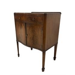 Early 20th century mahogany serpentine side cabinet, fitted with single drawer over two cupboard doors, each crossbanded with boxwood stringing, flanked by canted corners, raised on tapering supports with spade feet
