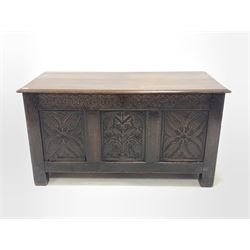 18th century oak coffer, with hinged lid over floral carved three panel front, raised on stile supports W132cm, H70cm, D59cm