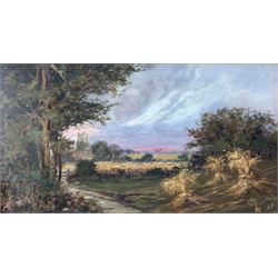 English School (19th/20th Century): Countryside Landscape with Wheatsheaves and Church, oil on canvas signed GW 45cm x 80cm