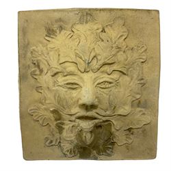 Cast stone wall plaque or mask in the form of a feminised Green Man, covered with oak leaves and acorns (35cm x 25cm); rectangular wall plaque with Green Man lozenge (39cm x 27cm); and another Green Man wall plaque (36cm x 34cm) (3)