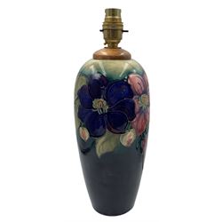 Moorcroft Clematis pattern table lamp, of ovoid form with graduated turquoise and blue ground, impressed 'Potter to H.M The Queen' and blue signature, H33cm overall