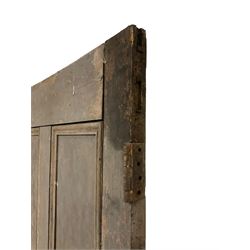 Large 19th century pine door, panelled with applied mouldings, fitted with two metal hinges