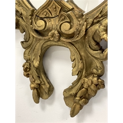 Early 20th century Rococo style gilt framed wall mirror decorated with scrolled foliage 