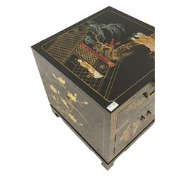 Pair Chinoiserie design cabinets, black lacquered with gilt decoration depicting figural scenes, fitted with single drawer and double cupboard