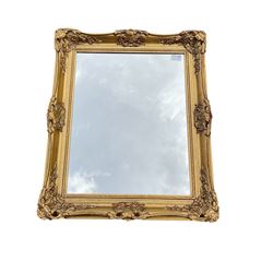 Rectangular wall mirror in embossed gilt frame