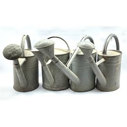 Set of four Galvanised watering cans, H43cm max