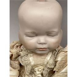 Bisque head doll with three faces H30cm and a Georgene Averill bisque head doll H40cm