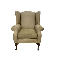 Queen Anne design wingback armchair, upholstered in beige textured fabric with cabriole supports