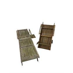 Two wooden sun loungers