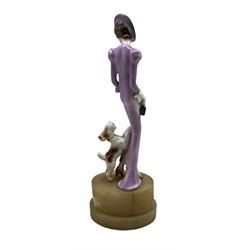 Art Deco pottery figure of a woman with a Fox Terrier by her feet, mounted on oval alabaster base H29cm, together with five Royal Doulton figures: two Dinky Do, Amy, Babie and Mandy (6)
