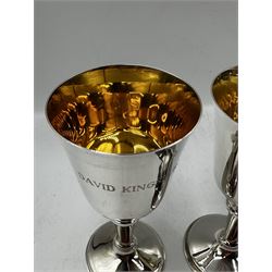 Set of twelve silver goblets with gilded interiors, tapering stems and circular foot, each engraved with a different name H16cm Birmingham 1968, 1972 and 1973 Maker W I Broadway & Co 60oz