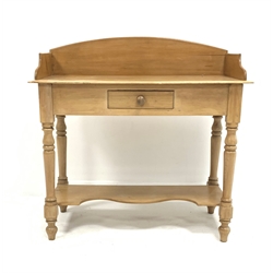 Victorian pine wash stand, with three quarter galleried top over single drawer, raised on turned supports united by under tier, W94cm