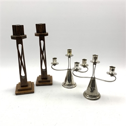  Pair Art Deco oak candlesticks with open twist stems on stepped bases and a pair of Falstaff silver-plated three branch candelabra H35cm   
