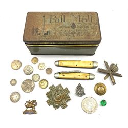 1920s Pall Mall cigarette tin containing a few military items including The Buffs (Royal East Kent Regt.) badge, coins and penknives