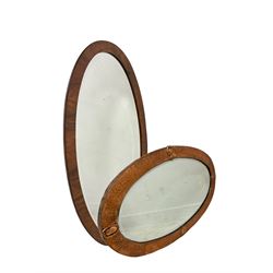 Two oval mirrors 