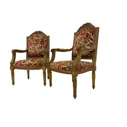 Pair Louis XVI design gilt framed armchairs, the cresting rail pierced with flower heads and roses, the frame moulded with borders of beading and repeating bellflowers, scrolled arm terminals decorated with acanthus leaves, the tapering supports with lappet design and rosette, upholstered in textured floral fabric with sprung seat